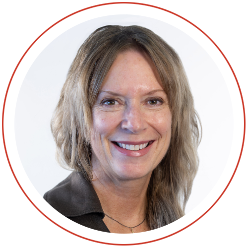 A professional woman in a black shirt, smiling into the camera, with a red circle border.