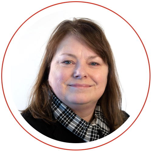 Woman wearing a black top with a checkered collared, in front of a white background, encircled by a red border.