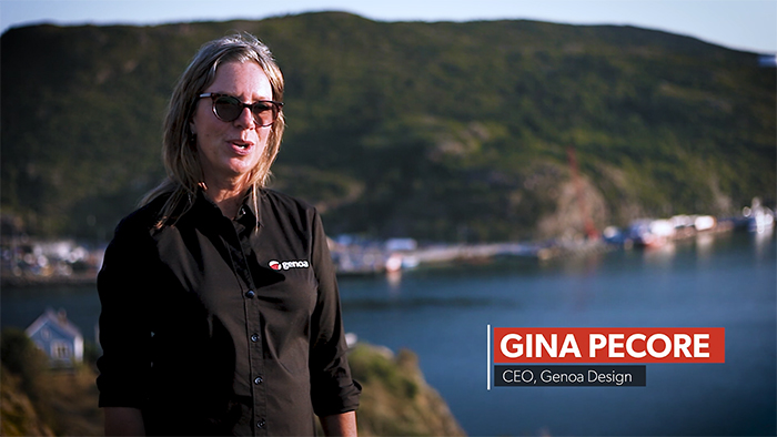 Gina Pecore, the CEO of Genoa Design speaking with the ocean and mountains in the background.