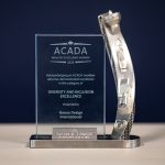 2023 ACADA Industry Excellence Award for Diversity and Inclusion presented to Genoa Design International, featuring a silver trophy with detailed engraving, against a dark blue background.